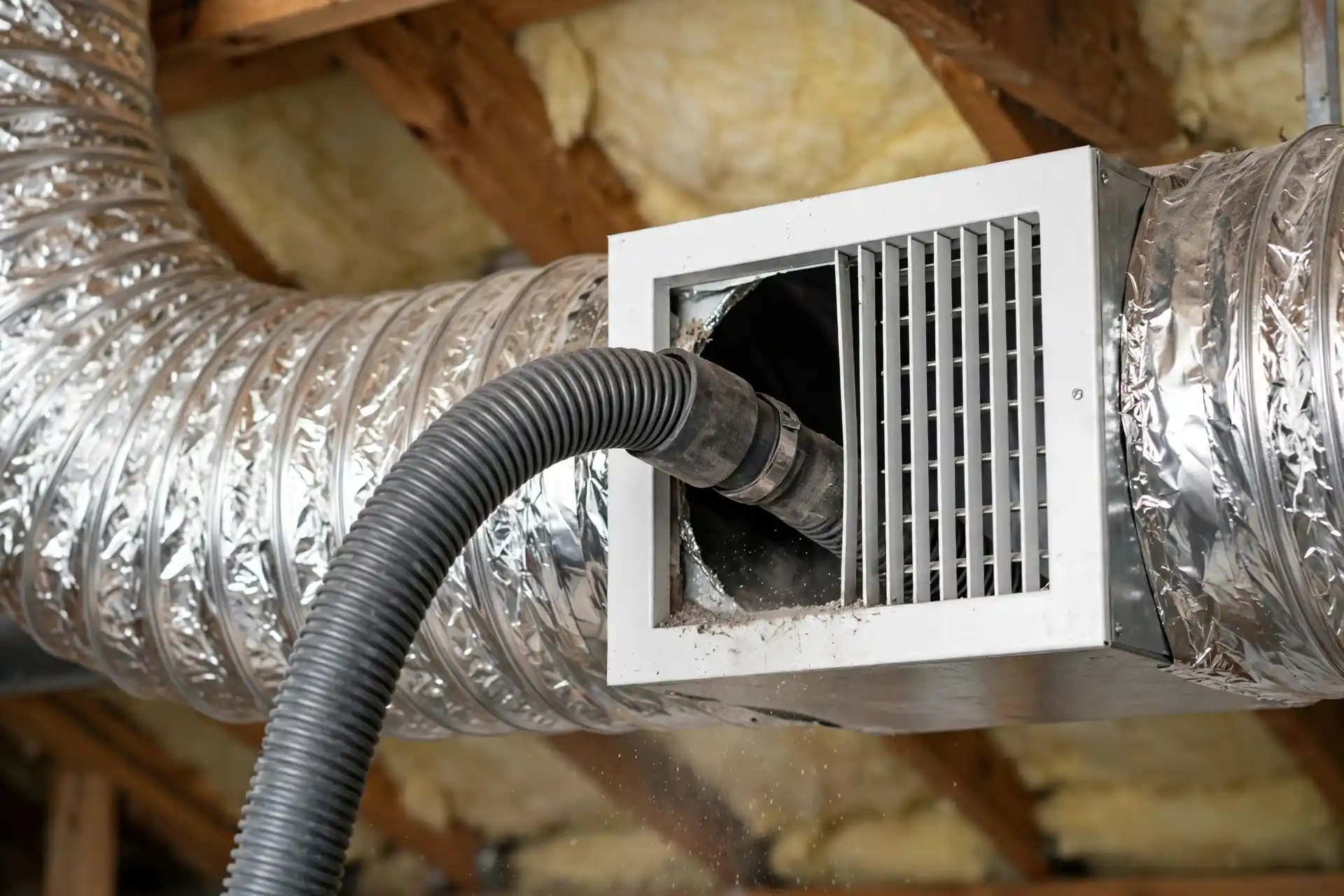 Professional duct cleaning equipment removing dust from air ducts in El Paso, TX